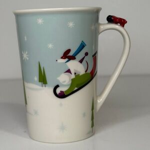 Starbucks 2011 Winter Wonderland Mug with Sledding Design and airplane on handle